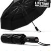 Windproof compact travel umbrella with 42-inch canopy, fiberglass frame, and TSA-approved design for reliable storm protection.
